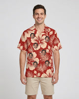 Hibiscus Woodcut Christmas Hawaiian Shirt with printed faces, worn by a man