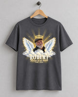 Charcoal in loving memory angel wings t-shirt on a wooden hanger with an older man's photo, golden halo, wings and clouds