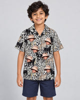 Jungle Prowl Hawaiian shirt with printed faces, worn by a child