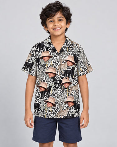 Jungle Prowl Hawaiian shirt with printed faces, worn by a child