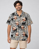 Jungle Prowl Hawaiian shirt with printed faces, worn by a man
