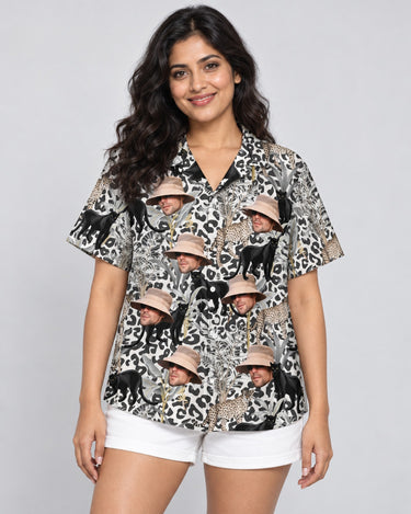 Jungle Prowl Hawaiian shirt with printed faces, worn by a woman