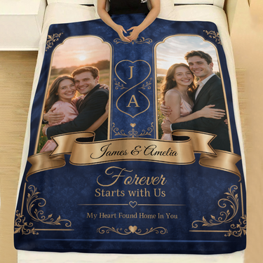 Navy damask couples photo blanket with gold filigree laid across a made bed