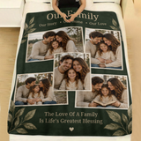 Personalised family photo blanket with gold leaf corners laid across a made bed with white linen