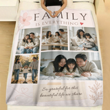 Personalized Family Is Everything photo blanket spread across a made bed with white linen bedding