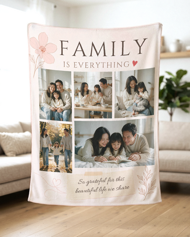 Blush pink five photo family collage blanket held up in a bright living room to show how the soft fleece drapes