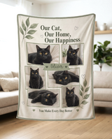 Cream and sage six photo cat blanket held up in a bright living room to show how the soft fleece drapes