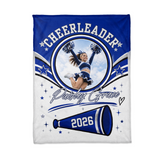Flat lay of the personalized cheerleader blanket showing the circle photo frame, star swooshes and the megaphone with the custom year