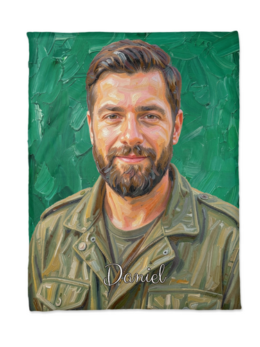 Flat lay of a custom portrait blanket with an oil painted bearded man on emerald green brushstrokes and the name Daniel