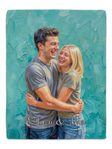 Full view of a personalised couple blanket printed with an oil painting of a laughing couple embracing on turquoise brushstrokes and the names Ethan & Mia
