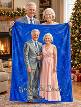 A senior couple holding up their anniversary oil painting blanket by the fireplace at Christmas, printed with their portrait on cobalt blue brushstrokes and the names George & Linda