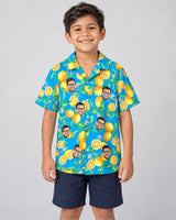 Lemon Grove Breeze Hawaiian shirt with printed faces, worn by a child