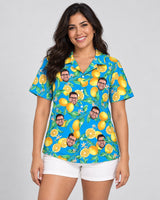 Lemon Grove Breeze Hawaiian shirt with printed faces, worn by a woman