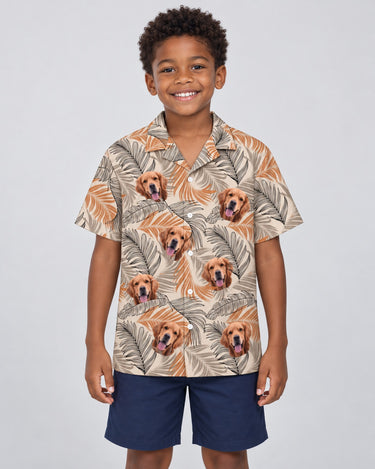 Lush Tropical Foliage Hawaiian shirt with printed faces, worn by a child