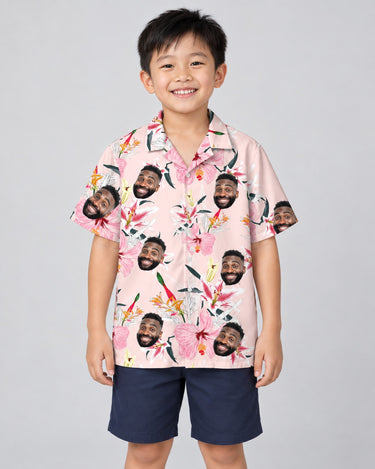 Luxe Hibiscus Silk Tropical Hawaiian shirt with printed faces, worn by a child