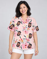 Luxe Hibiscus Silk Tropical Hawaiian shirt with printed faces, worn by a woman