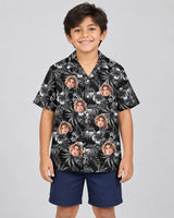 Midnight Hibiscus Paradise Hawaiian shirt with printed faces, worn by a child
