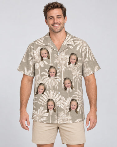 Monochrome Tropics in Cotton Grey Hawaiian shirt with printed faces, worn by a man