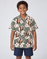 Monstera Hibiscus Dream Hawaiian shirt with printed faces, worn by a child