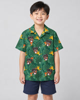 Monstera Paradise Hawaiian shirt with printed faces, worn by a child
