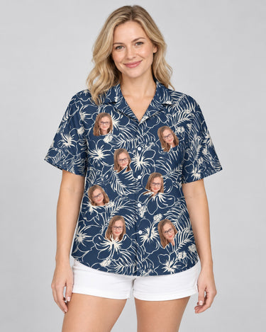 Navy Hibiscus Paradise Hawaiian shirt with printed faces, worn by a woman