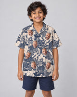 Navy Ivory Patriot Hawaiian shirt with printed faces, worn by a child
