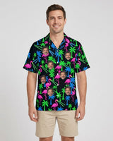Neon Flamingo Ugly Hawaiian Shirt with printed faces, worn by a man