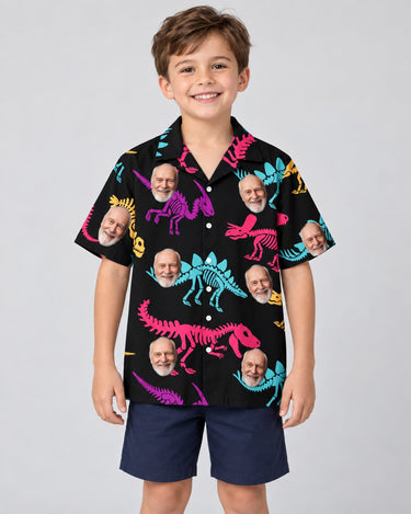 Neon T-Rex Hawaiian shirt with printed faces, worn by a child