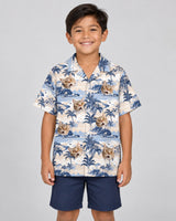 Nostalgic Tropical Paradise Hawaiian shirt with printed faces, worn by a child