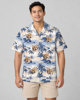Nostalgic Tropical Paradise Hawaiian shirt with printed faces, worn by a man