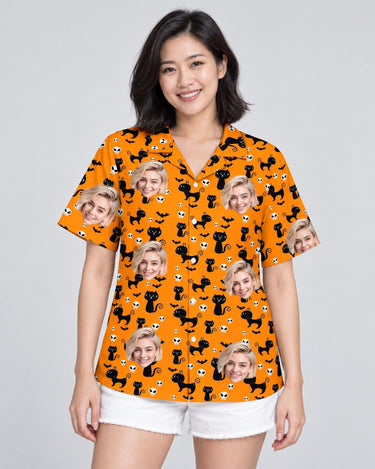 Orange Black Cat Halloween Hawaiian shirt with printed faces, worn by a woman