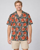 Orchid Isle Hawaiian shirt with printed faces, worn by a man