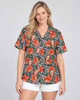 Orchid Isle Hawaiian shirt with printed faces, worn by a woman