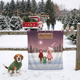 Our First Christmas Together couple blanket with faces and a beagle, hung on a fence at a Christmas tree farm