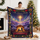 Personalized Nativity Christmas blanket with family name and Bible verse held up on Christmas morning beside the tree