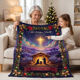 Grandmother and granddaughter with a navy Nativity Christmas blanket showing the Star of Bethlehem and a King James Bible verse