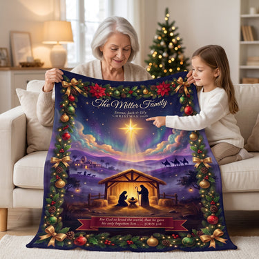 Grandmother and granddaughter with a navy Nativity Christmas blanket showing the Star of Bethlehem and a King James Bible verse