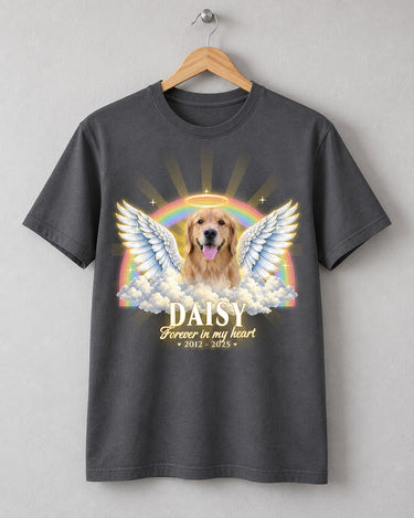Charcoal pet memorial t-shirt on a wooden hanger with a dog with angel wings, a halo and a rainbow and the name Daisy