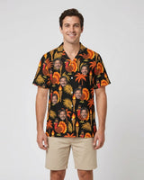 Pilgrim Turkey Tiki Thanksgiving Hawaiian Shirt with printed faces, worn by a man