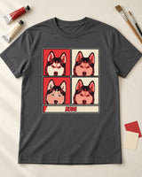 Charcoal pop art pet portrait shirt laid on an ivory studio table beside paint tubes, brushes and color swatches, showing the red and cream print.