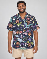 Prehistoric Garden Dinosaur Floral Hawaiian shirt with printed faces, worn by a man
