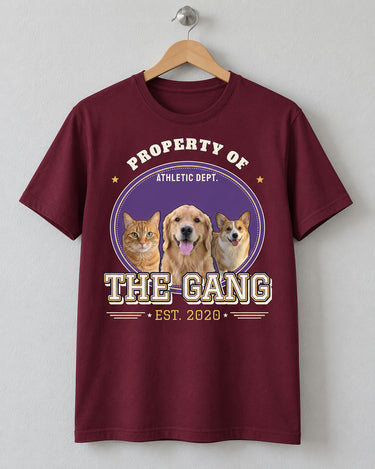 Maroon pet varsity shirt on a wooden hanger, with three pet photos in a purple and gold oval patch, THE GANG lettering and an EST. 2020 year row.