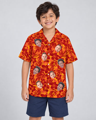 Red and Orange Tropical Silhouettes Hawaiian shirt with printed faces, worn by a child