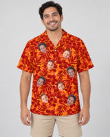 Red and Orange Tropical Silhouettes Hawaiian shirt with printed faces, worn by a man