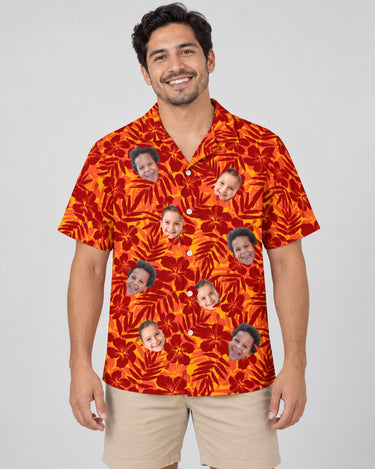 Red and Orange Tropical Silhouettes Hawaiian shirt with printed faces, worn by a man