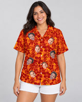 Red and Orange Tropical Silhouettes Hawaiian shirt with printed faces, worn by a woman