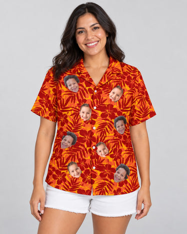 Red and Orange Tropical Silhouettes Hawaiian shirt with printed faces, worn by a woman