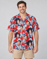 Red Hibiscus Tropics Hawaiian shirt with printed faces, worn by a man