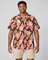 Rosy Paradise Hawaiian shirt with printed faces, worn by a man