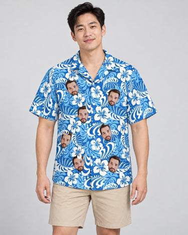 Royal Blue Tropics Hawaiian shirt with printed faces, worn by a man